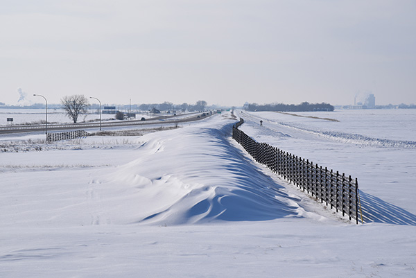 Structural snow fence with drift located on Interstate 94 and Highway 336.